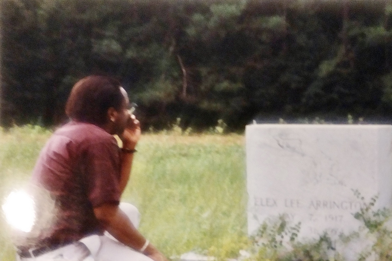 Robert Arrington visiting his father’s grave, circa 1990s, Rich Square, NC. Robert shares, “I was in my early twenties and releasing grief.” Photo courtesy of Robert Arrington.