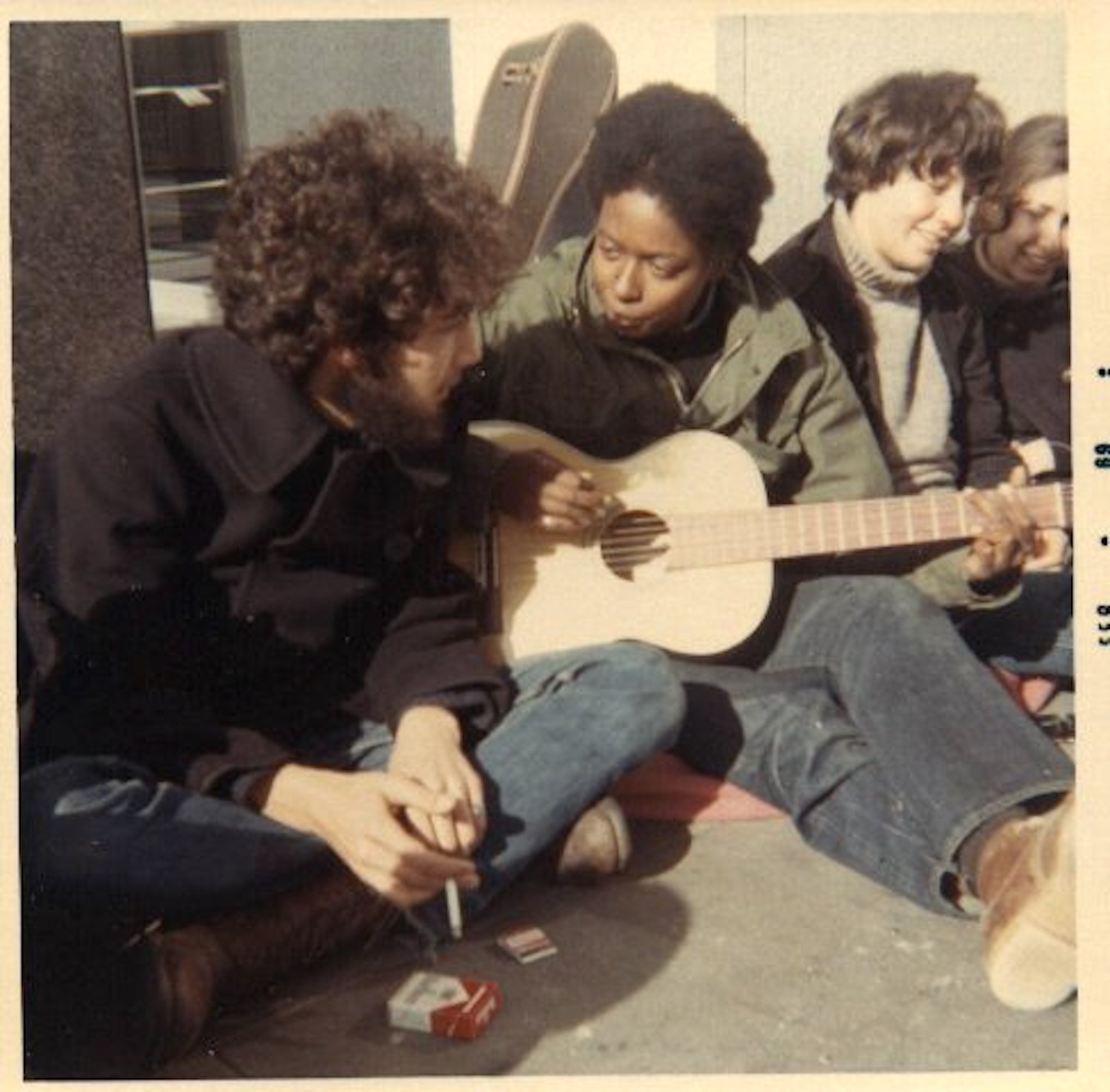 Mandy playing guitar at the Biafra Festival, 1969. San Francisco, CA. Photo courtesy of Mandy Carter.