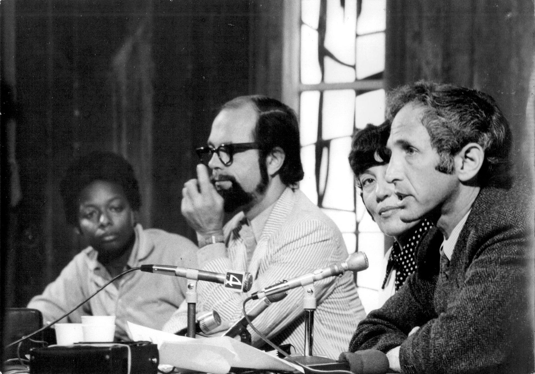(L-R): Mandy Carter, David McReynolds, Irma Zigas, and Daniel Ellsberg during a press conference at the San Francisco International Airport; August 3, 1973; San Francisco, CA. Photo Credit: Nancy Purser. Mandy shares, “This was prior to Ellsberg doing a workshop on the Pentagon Papers at the War Resisters League 50th Anniversary Conference in 1973.” Photo courtesy of Mandy Carter.