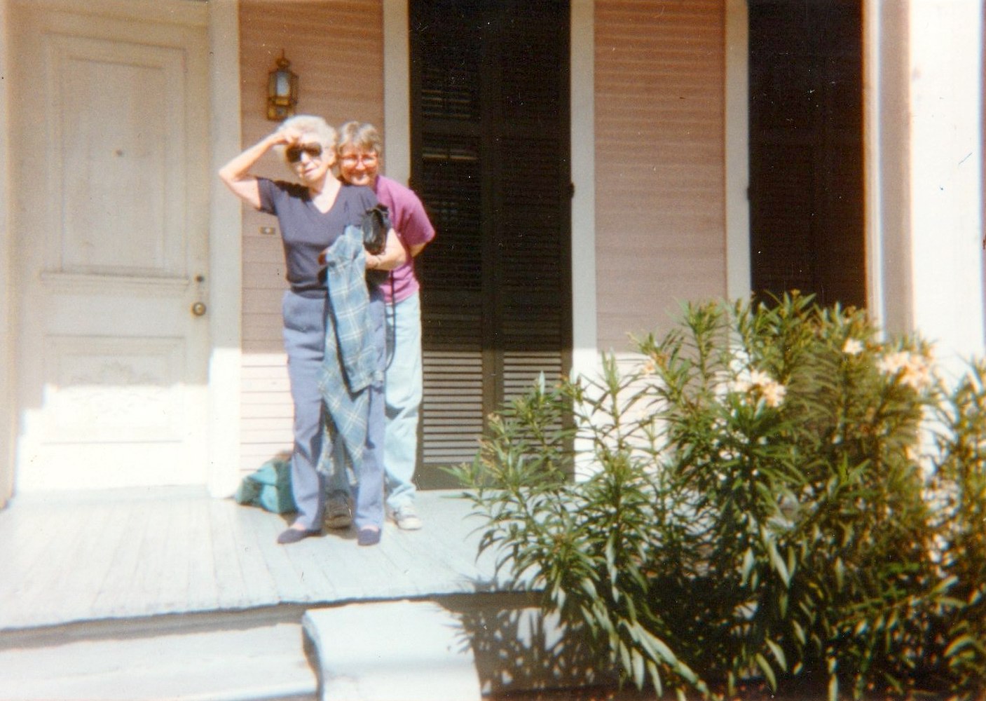 Anne and her mother in front of one of their apartments, New Orleans, LA. Photo courtesy of Anne Charles.