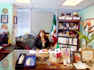 4.	Elia Chinó in her office at FLAS headquarters, Houston, Texas, circa 2016. Photo courtesy of Elia Chinó.