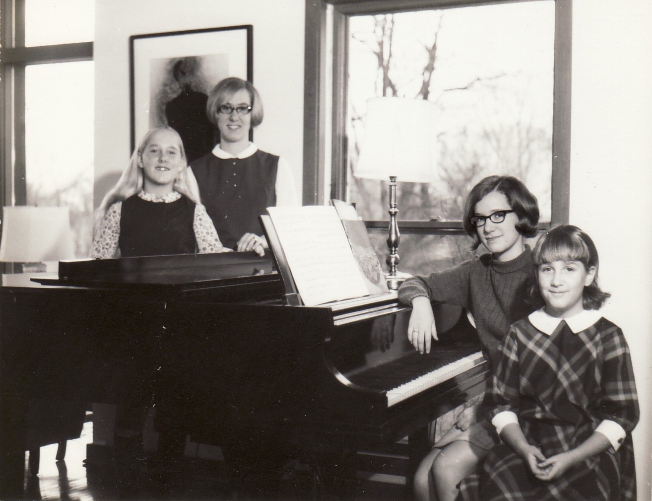 A childhood portrait of Jennifer and her sisters (Julie, Karen, and Katie Crossen) at the family’s baby grand piano in Lexington, KY, 1967. 