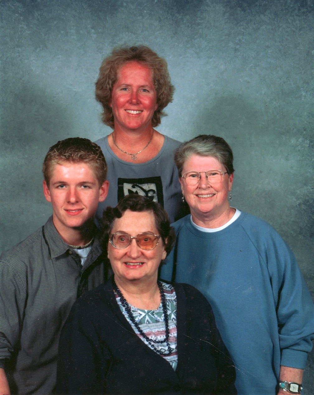 A church directory portrait of Jennifer Crossen, Joan Callahan (her partner), David Crossen (her son), and Betsy Churchill (her mother) in Lexington, KY, 2002.