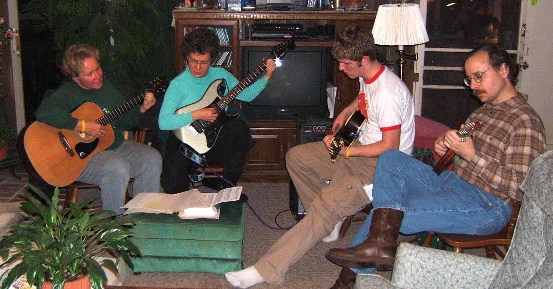 Jennifer Crossen playing music with Katie Crossen (sister), David Crossen (son), and Lenny Dentinsass in Lexington, KY, 2003.