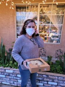Rosa holding one of the pies sent to the COVID-19 Meals to Heal volunteers as a token of appreciation, 2020. Photo courtesy of Rosa Diaz.