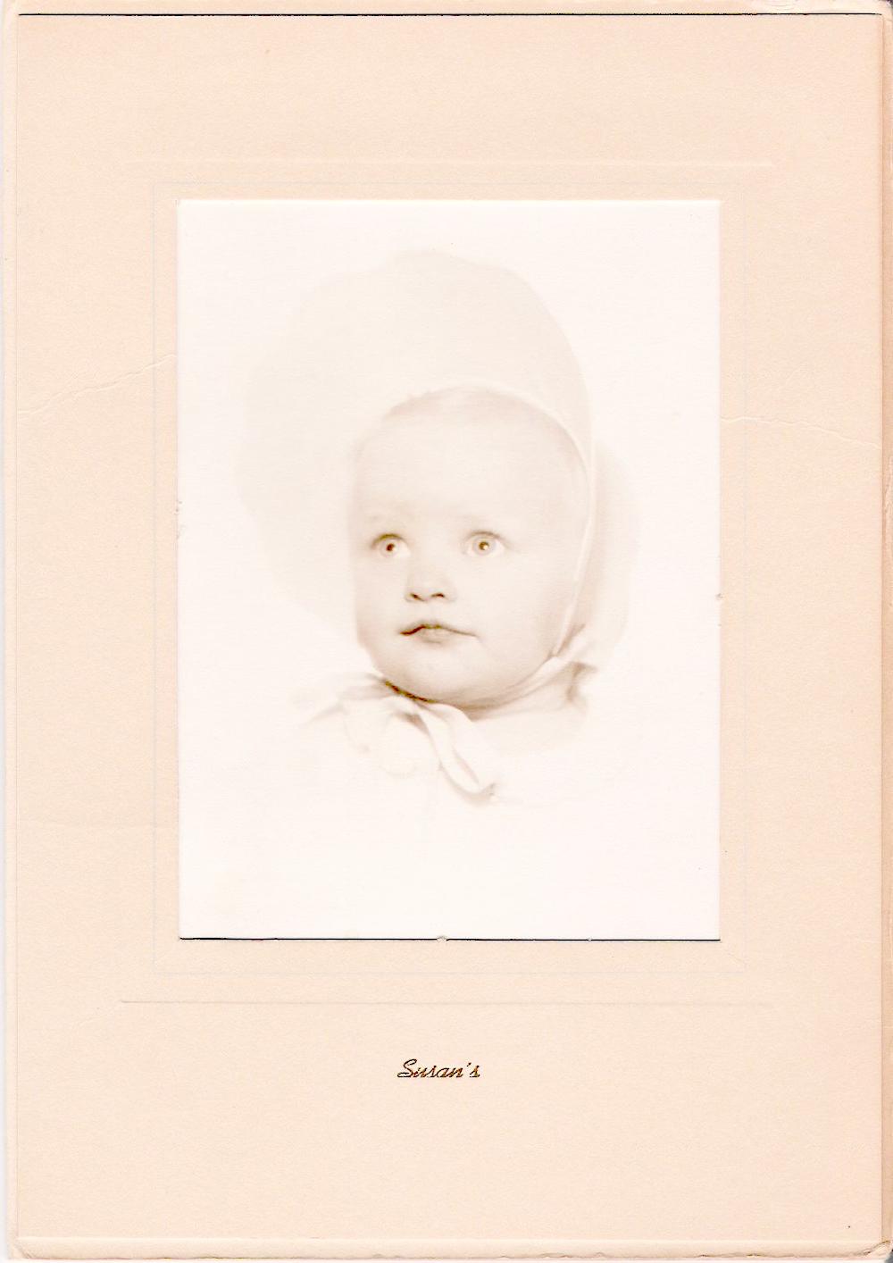 Susan as an infant in bonnet. Photo courtesy of Susan Griffin.