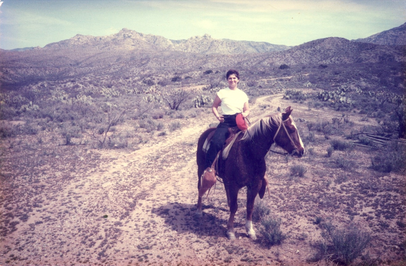 Michela on a horse, which is her “favorite place to be”, in Klondyke, AZ, 1988. Photo courtesy of Michela Griffo.
