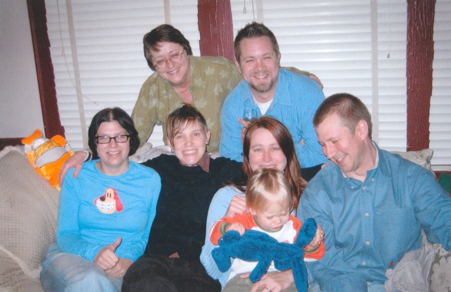 Katie Hiers with the Bark Family, 2005. The top row includes Kathie Hiers and Dave Bark (Donna McGahre Bark’s son). The bottom row includes Amy Patt (Dave Bark’s fiancee), S.B. Brown (Dave & Amy’s stepsister), Amy Bark (Donna McGahre Bark’s daughter) holding Kyle Nicholas (her son), and Edward Nicholas (Amy’s partner). Photo courtesy of Kathie Hiers. 