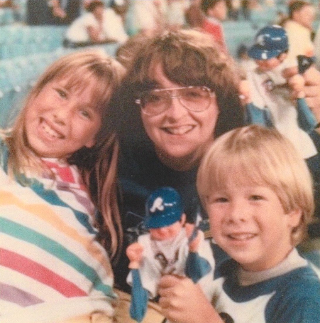 Kathie Hiers with Amy Bark and Dave Bark (the kids of her then-partner Donna McGahre Bark) at the Atlanta Braves Game, July 4th, 1985. Photo courtesy of Kathie Hiers.