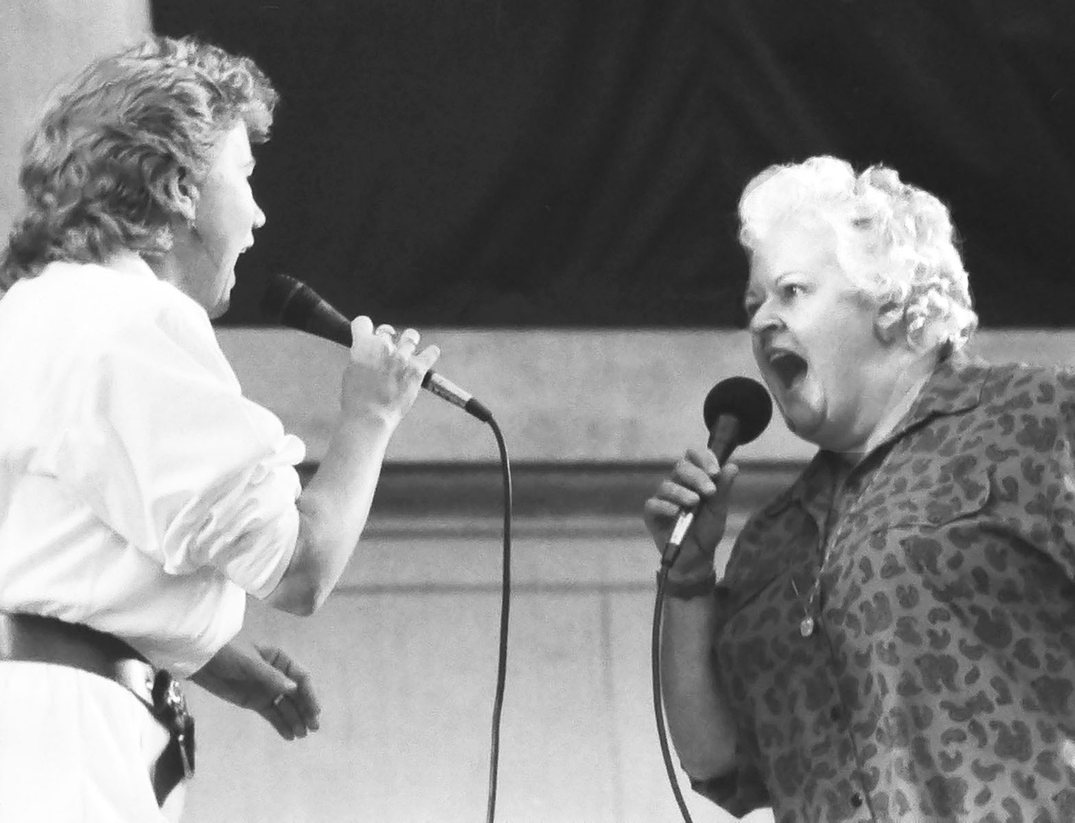 Holly Near and Ronnie Gilbert performing at the Redwood Music Festival at Greek Theatre, Berkeley, CA, 1985. Photo Credit: J.A. Rubino. Photo courtesy of Holly Near.