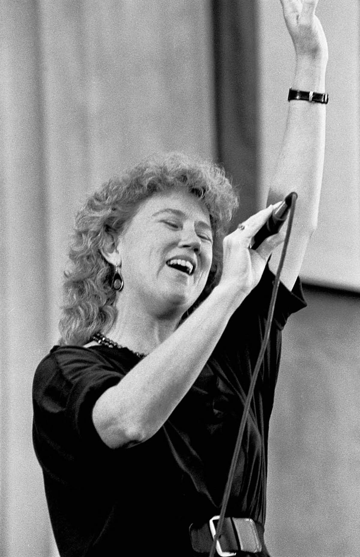 Holly performing at the Redwood Music Festival at Greek Theatre, Berkeley, CA, 1986. Photo Credit: J.A. Rubino. Photo courtesy of Holly Near.