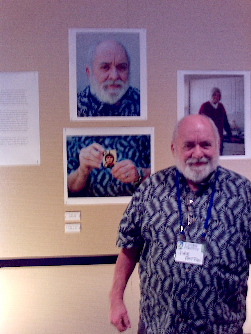 Jude at the Gender Odyssey conference, 2016. He is standing in front of photos taken by Jess Dugan for his photobook, To Survive on This Shore. Photo courtesy of Jude Patton.