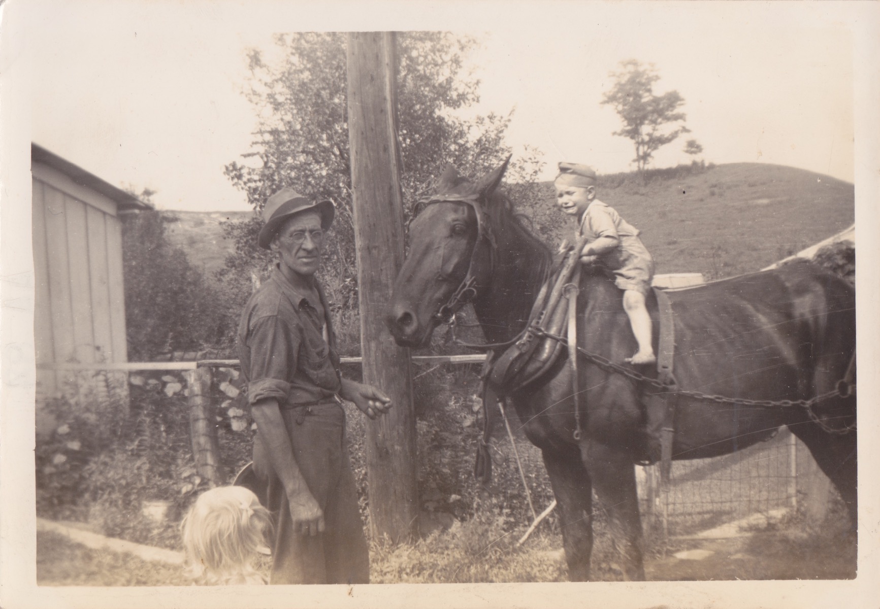 K.C. Potter (grandfather) and K.C. Potter on top of a horse. 