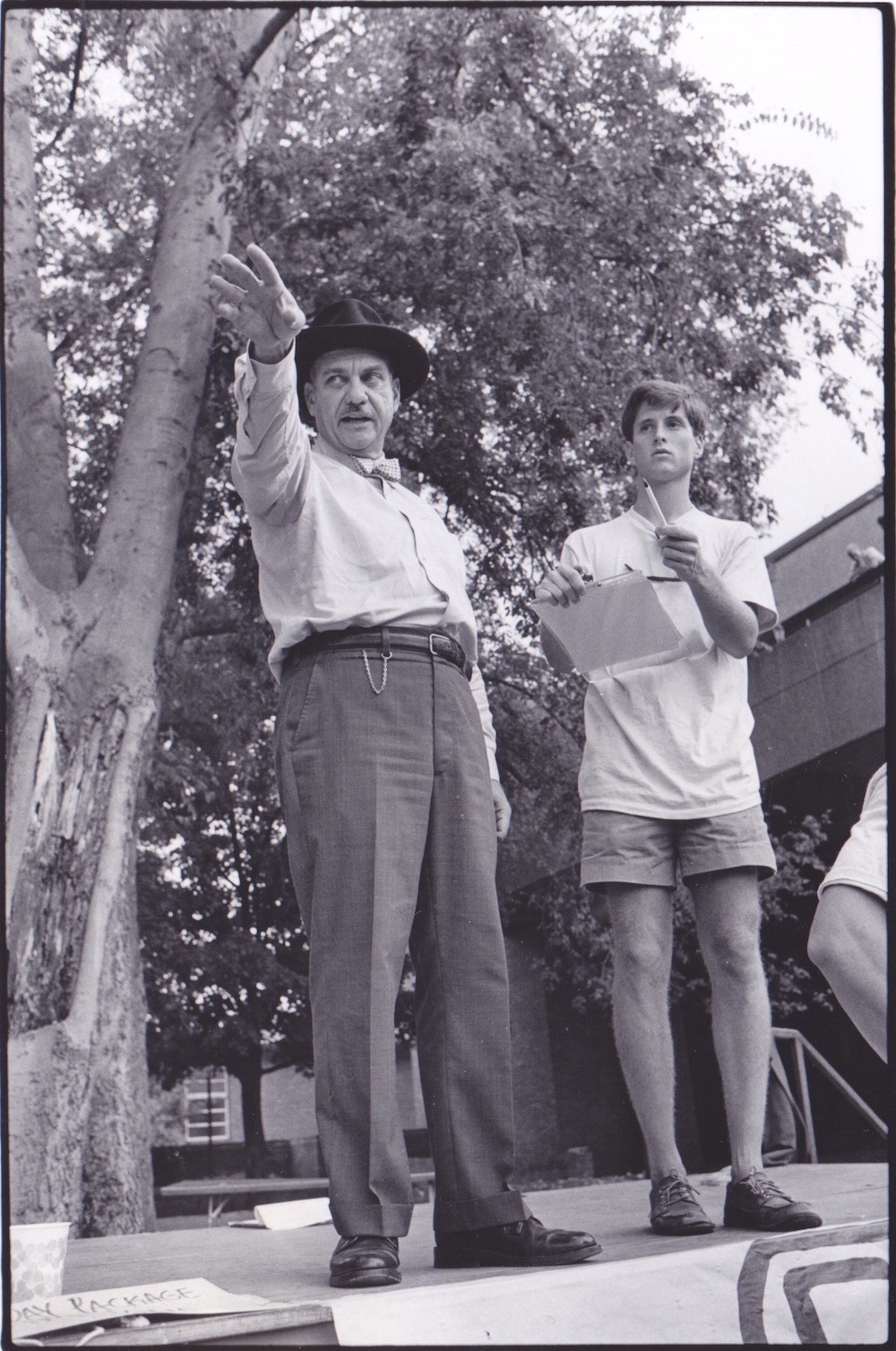 Dean K.C. Potter conducting an auction on Vanderbilt University campus for a student group, Nashville, TN, 1985.