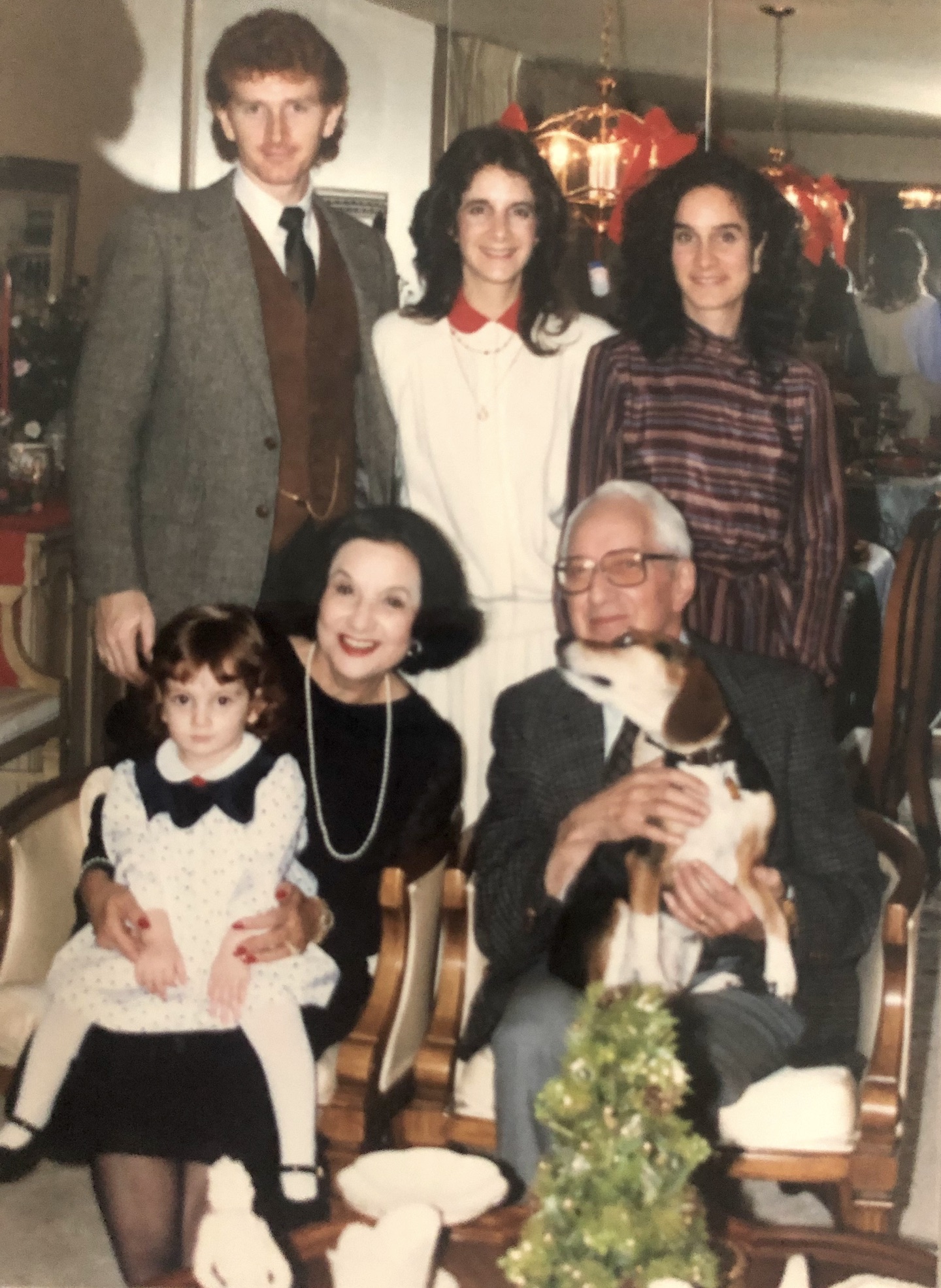 A portrait of the Laham family circa 1980. Cheryl shares, “Same story, different year: my sister's husband, their dog, and first child were all included here, but my partner was not allowed to come to Kansas.” Photo courtesy of Cheryl Qamar.
