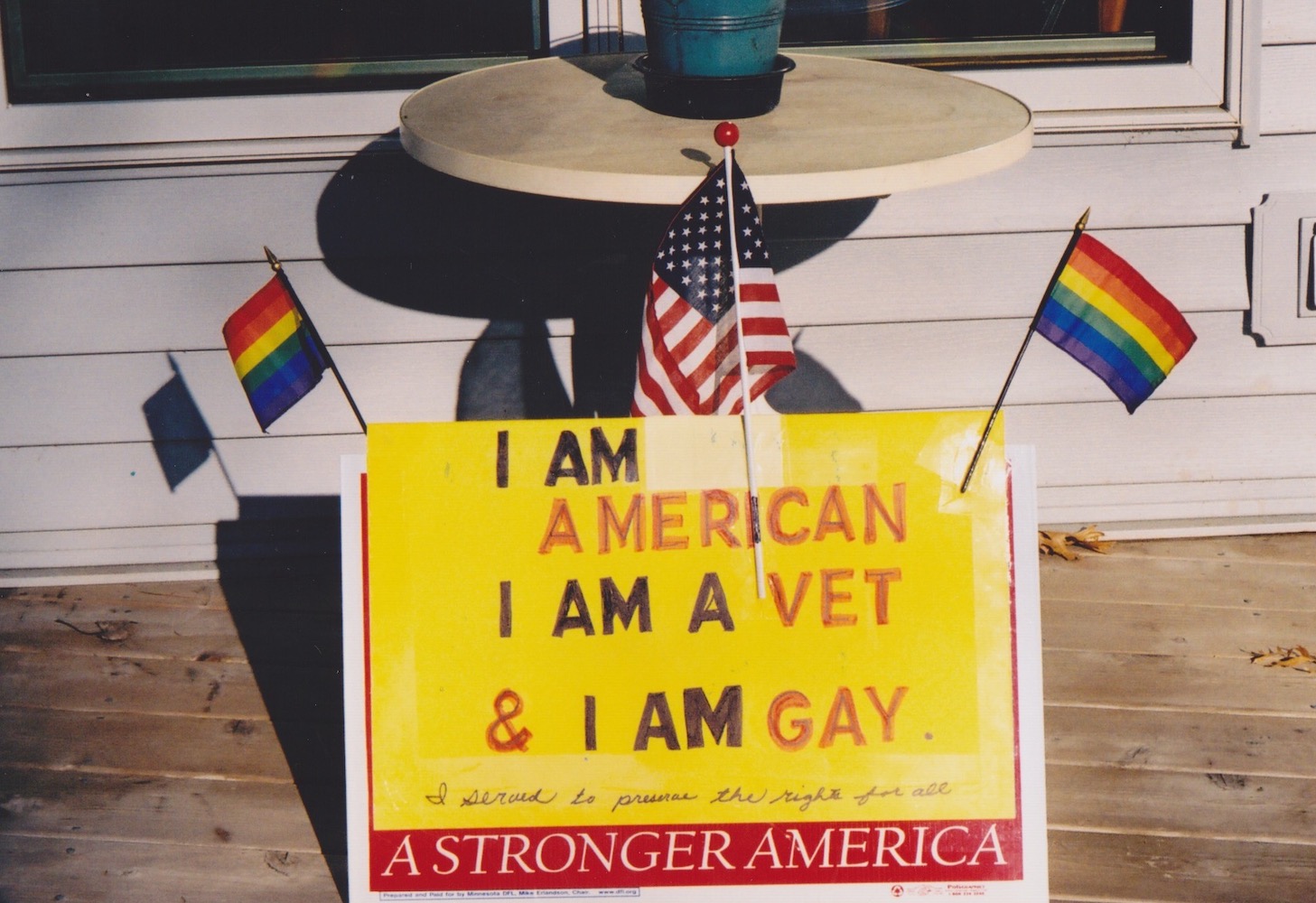 One of Don’s signs, that was carried to a Lobby Day, reads, “I Am American, I Am a Vet, and I Am Gay. I served to preserve the rights for all.” The sign’s border says, “A Stronger America” and has two pride flags and an American flag taped to it. Photo courtesy of Don Quaintance. 