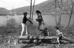 Diana playing with her three sons Kevin Folley, Paul Sterling, and Sean Folley in Turkey Hill Lake, NY, circa 1960s.