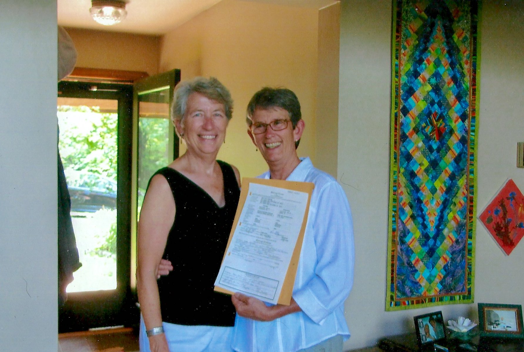 Kim Stacy (age 58) with her wife Anne Harrison at their marriage ceremony, July 16, 2015.