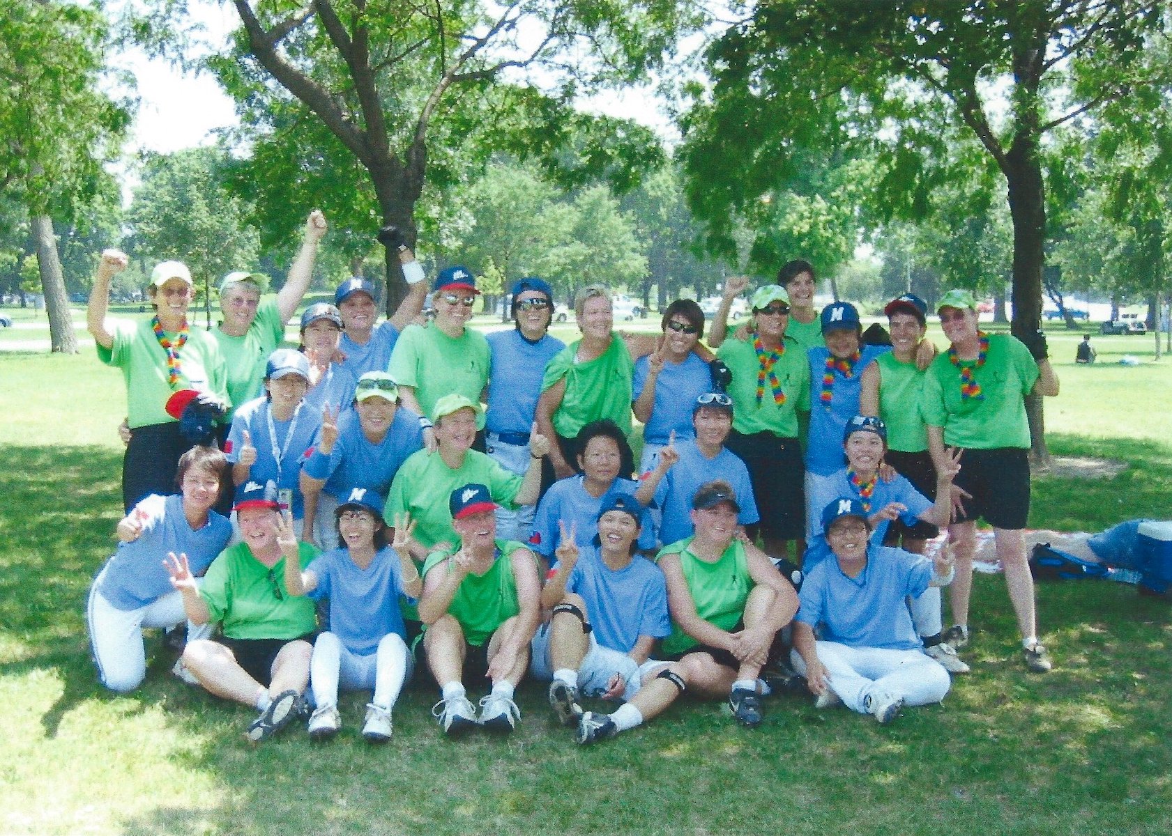 Kim Stacy (placed on the far left in the back row) with her softball team, Custom Designed, in green shirts and the Taiwanese softball team in blue shirts at the Gay Games, Chicago, IL, 2006.