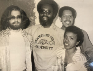 Jewel smiling with her friends, 1970s.  L-R: Unknown, Unknown, Jewel’s spiritual brother Avery, Jewel. Photo courtesy of Jewel Thais-Williams.