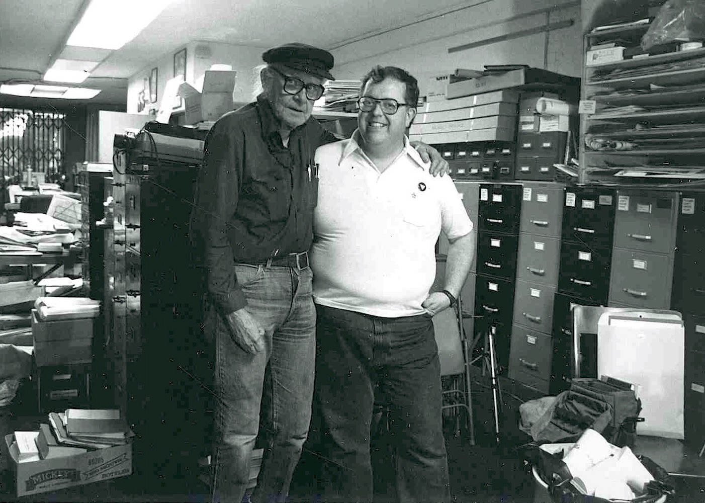 Jean-Nickolaus Tretter and Harry Hay at the od International Gay and Lesbian Archives, Hollywood, CA. Jean-Nickolaus shares, “The archives were in danger of being lost, so I came and stayed with Harry and John Burnside to help out for a couple of weeks. I’ve been a board member since 1982.” Photo courtesy of Jean Tretter.