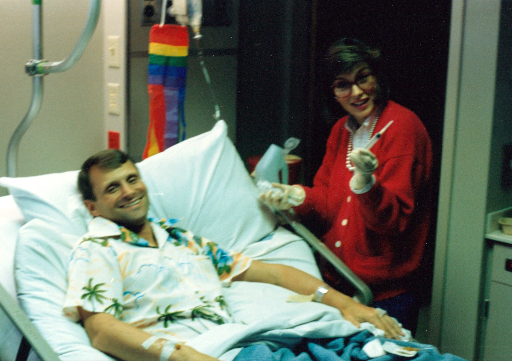 Terry Tebedo and noted entertainer Paul Williams in Tebedo’s hospital room, Dallas, TX, circa 1986. William shares, “After Terry Tebedo’s diagnosis of Non-Hodgkin’s Lymphoma, he had surgery to remove his spleen that was enlarged by chemotherapy. We arranged for Paul Williams to visit.” Photo courtesy of William Waybourn.