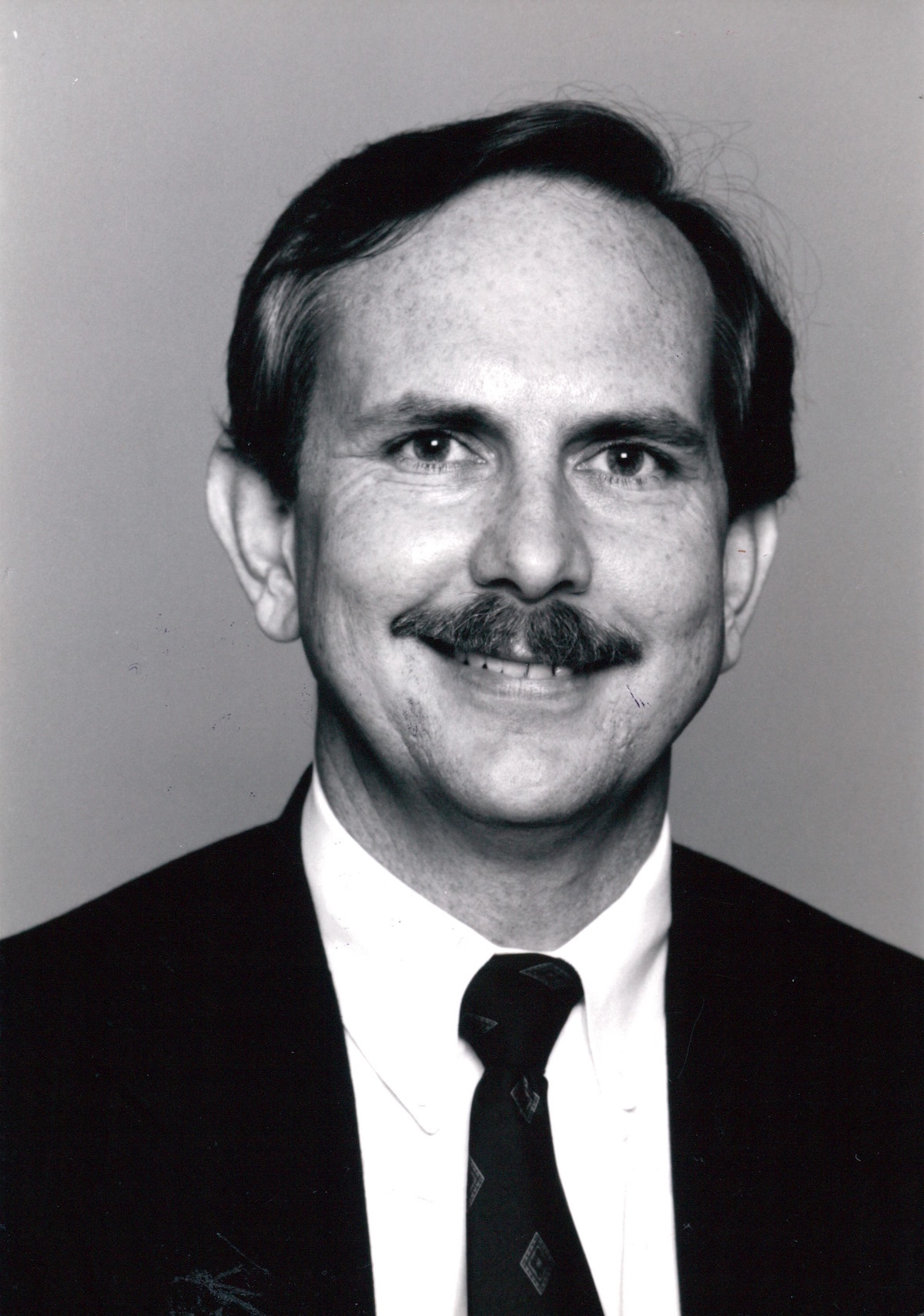 William Waybourn’s official Dallas Gay Alliance headshot, Dallas, TX, circa 1985. William shares, “I enforced a rule that whenever LGBTQ activists appeared in the media, they had to wear a coat and tie or dress to skew stereotypical images of our community.” Photo courtesy of William Waybourn.