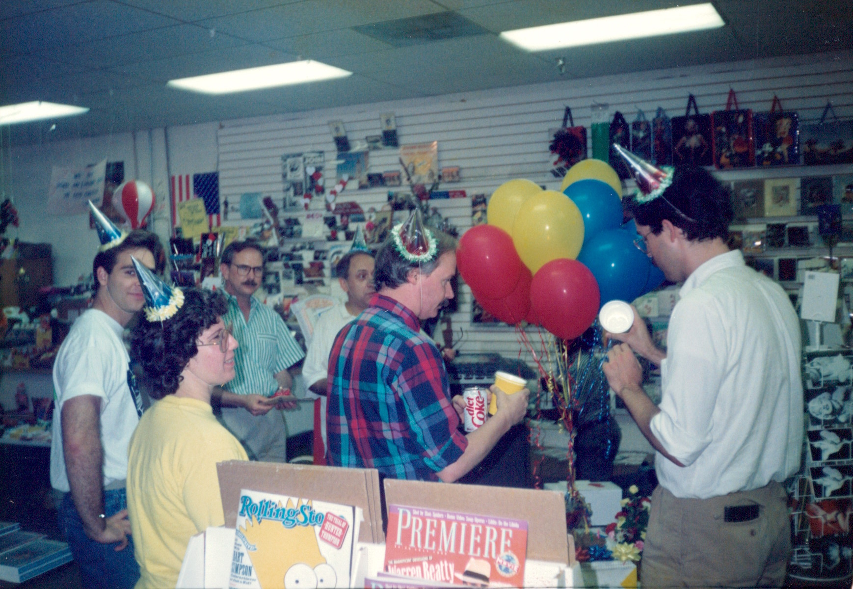 L-R: Charles Longstaff, William Waybourn, Craig Spaulding, and Charles Johnson at the Crossroads Market in Dallas, TX, 1995. William shares, “This was during one of the many Crossroads Market “parties” we held during store hours to liven up things during an otherwise bleak period of AIDS sickness and death.” Photo courtesy of William Waybourn.