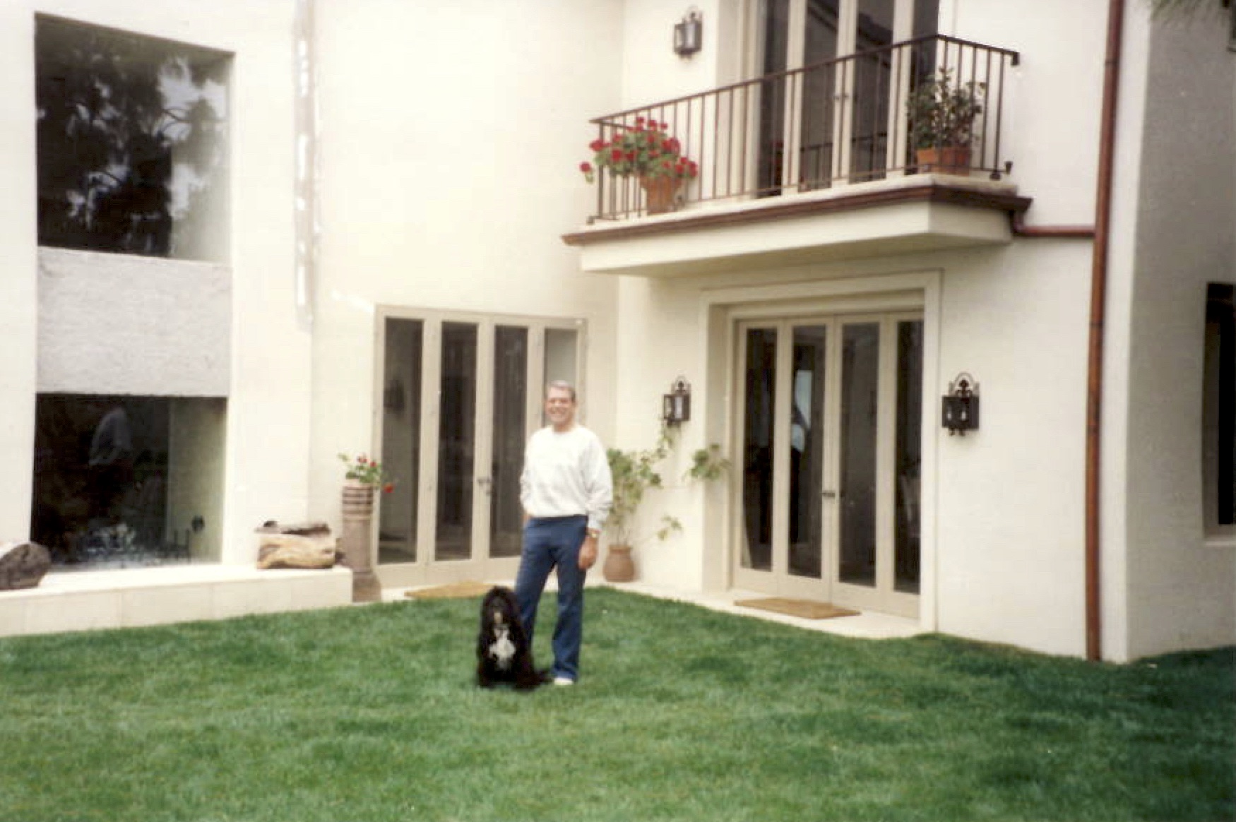 Chuck with his dog at his house in Malibu, CA.