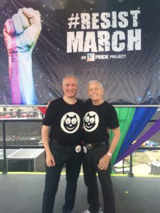 Pride Grand Marshal Alexei Romanoff (right) with David Farah on the Main Stage at the Resist March, 2017.