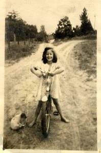 Barbara as a child spending her first years in the country. She shares, “There I would roam on my horse, Prince, with no fences… hours and hours of adventure…”
