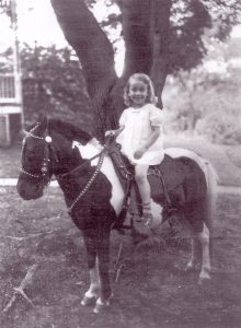 BobBI Keppel, age 4, sitting on a pony, 1936, Kensington, MD. BobBI writes, “During the depression, the pony’s owner went house to house persuading parents to have their children’s pictures taken with the pony.”