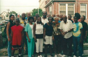The Grand and Martin families gather outside of Cassandra’s family home after her mother Val Grant’s passing, Queens, NYC, July 2002. Photo courtesy of Cassandra Grant.