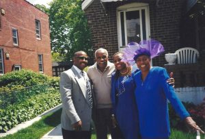 Cassandra Grant, her father Joe, her brother Terry, and her mother Val Grant celebrating Val’s birthday outside of their family home, Queens, NYC. Photo courtesy of Cassandra Grant.