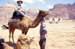 Charles Silverstein riding a camel, Jordan, 2010.