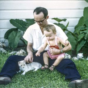 A similar image of Charles with his Father and another cat. Charles shares, “As I look back I note the similarities in our face and head shapes.”