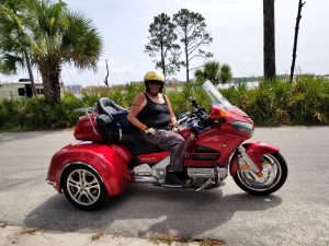 Charlotte on her motorcycle, Florida, 2018. She shares, “I moved to Florida. I’m a passionate long distance rider. Love the wind in my face… and the rain, haha.”