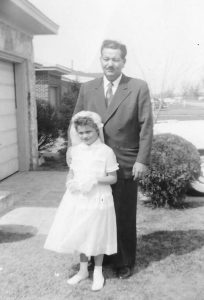 Charlotte and her father for her first communion, circa 1950s.