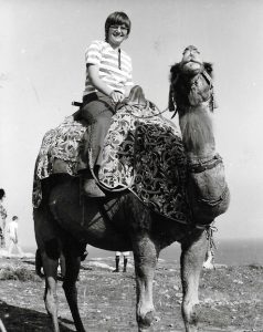 Charlotte stationed overseas and riding a camel in Jerusalem, 1971-1973.