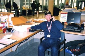 Cliff volunteers at the front information desk at the Department of Veteran Affairs, Voluntary Services, Boston, MA, 2008.