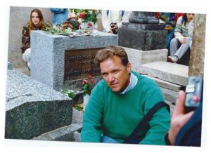 David at Jim Morrison’s grave in Paris, France, 1993. Photo courtesy of David Mixner.