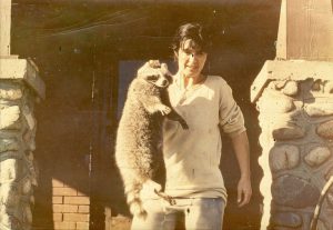 Diana removing a rascally raccoon from a school kitchen in Canada, circa 1960s.