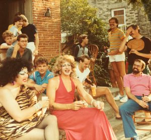 Dick Wagner among friends on his house stoop (holding fan) for a Labor Day party.