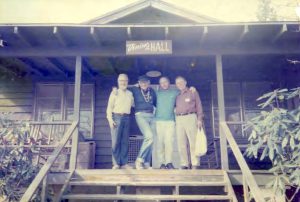 Group photograph at first Gay Spirit Visions Conference, pictured with (L-R) John Burnside, Harry Hay, Franklin Abbott, and unknown, 1990, Highlands, NC.

Abbott writes: “Harry was the founder of the Mattachine Society and he and John were among the creators of the National Radical Faerie Movement.  Harry and I were keynotes at the conference along with Andrew Ramer.  GSV conferences are still held at The Mountain, a retreat center on Little Scaly Mountain near Highlands, NC.”