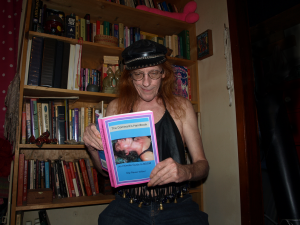 After over two years of working on a book, Gigi Raven Wilbur holds a published copy of The Dominant’s Handbook: an Intimate Guide to BDSM Play (published 2009).