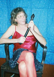 Gigi Wilbur in 2006. Gigi writes, “I wanted a Sex-Positive image depicting the joy of being a Hermaphrodite with a favorite adult play toy.”