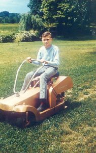 JD Doyle as mows the lawn.