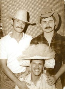 TJ Jordan, JD Doyle (right), and Mike Mikela (seated) at the Texas Gay Rodeo, November 17, 1985.