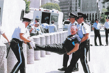 Jim Darby, along with several other members of Gay, Lesbian, and Bisexual Veterans of America (GLBVA), is arrested at a White House protest against the military’s “Don’t Ask Don’t Tell” policy, 1993, Washington, D.C.
