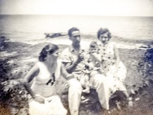 Juan-Manuel Alonso, 9 months old, with parents and aunt Rosa by the sea shore, 1952, Havana, Cuba.